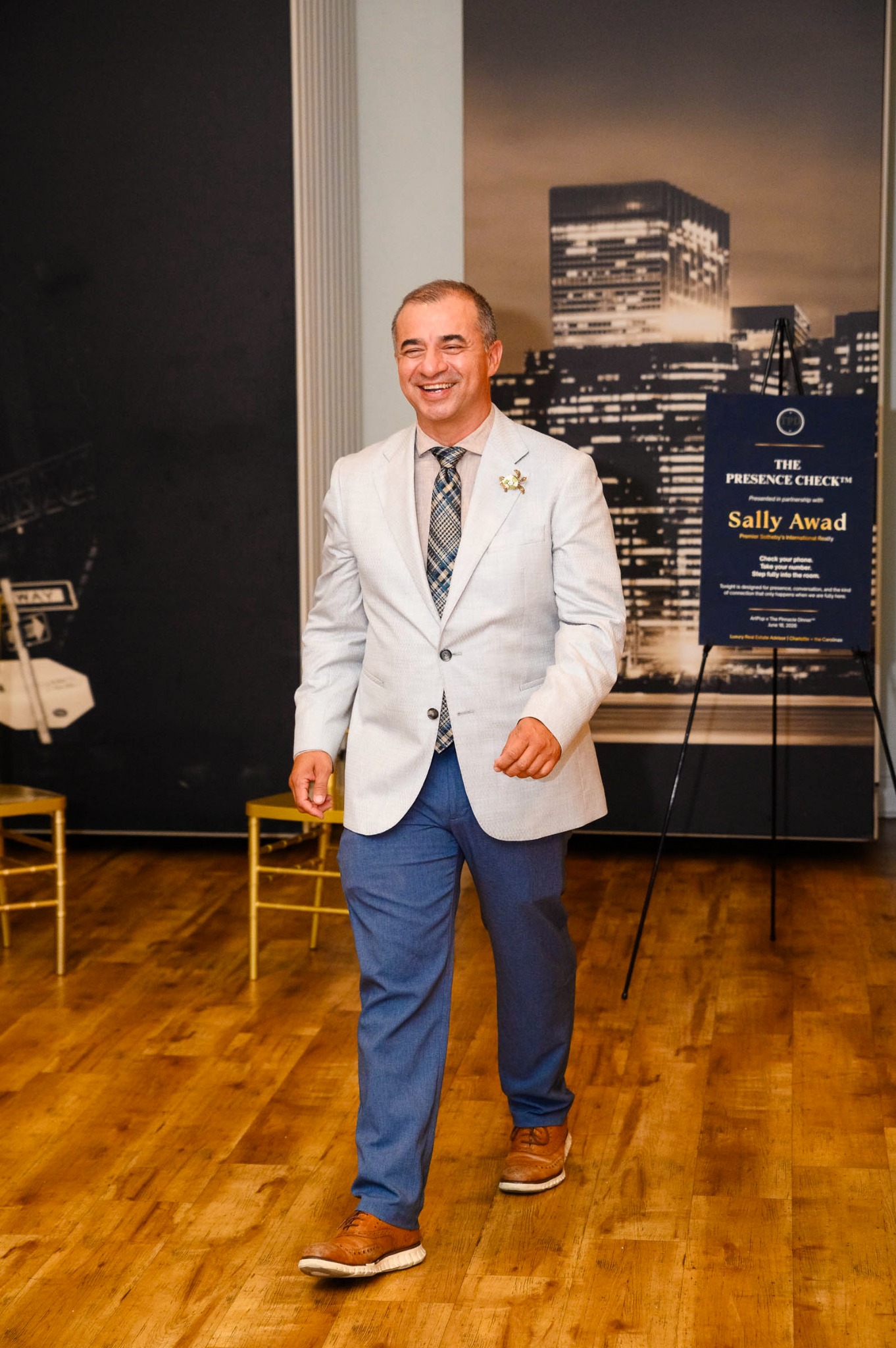 Manolo Betancur smiling as he arrives at The Pinnacle Dinner